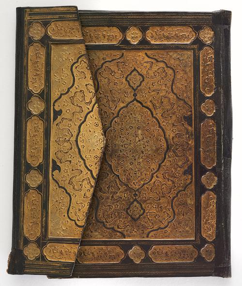 Closed exterior bookbinding cover with flap. Brown with gold central rectangular panel gilt-stamped with floral motifs and cloud bands. The cover and flap have a gold central medallion and corner pieces, gilt-stamped border bands of foliate cartouches.