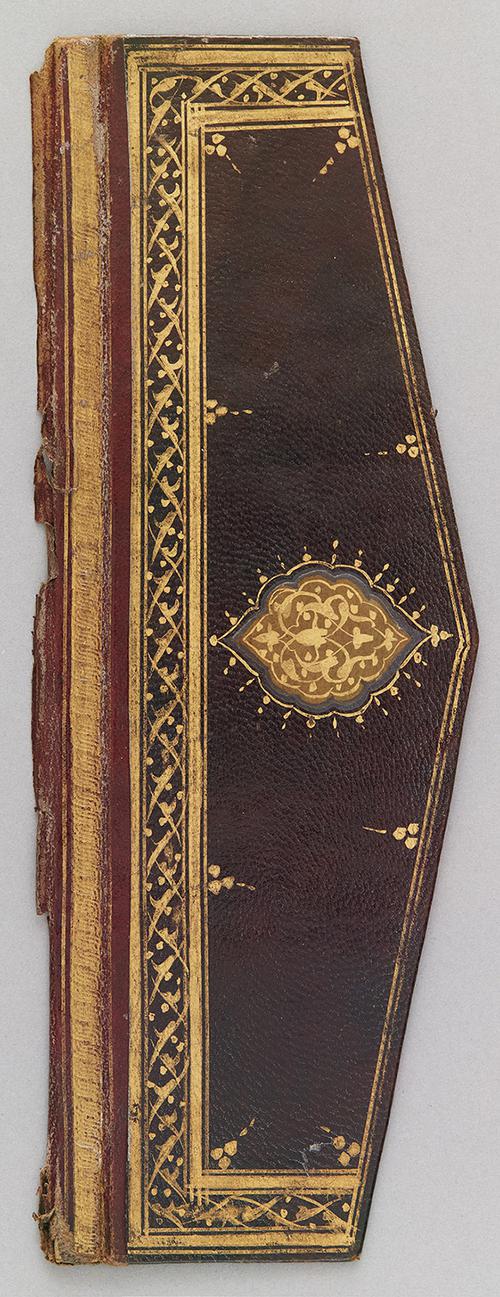 Outer cover of a dark-brown leather flap of a Turkish book binding. Gilt stamped rosace medallion and border. Rosace is gold outlined in blue, and the spine is red and gold.