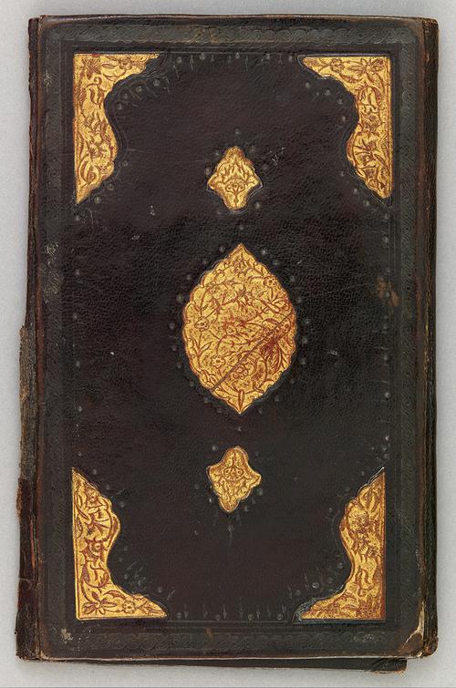 Back of black leather eighteenth-century Turkish book binding. Gilt embossed centre motif, and further decorated with gilt embossed corners.
