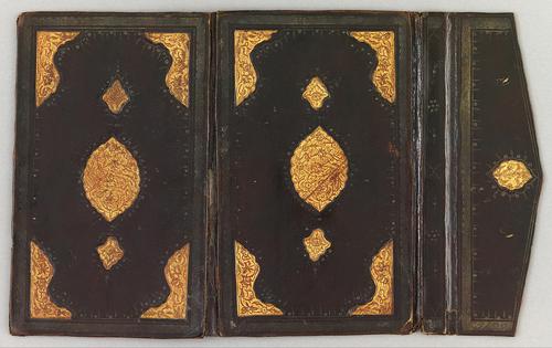 Black leather eighteenth-century Turkish book binding, laid open flat with flap. Both sides are mirror images of one another with a gilt embossed Centre motif along with gilt embossed corners. The flap also contains a similar decorative element as the larger Centre motifs. 