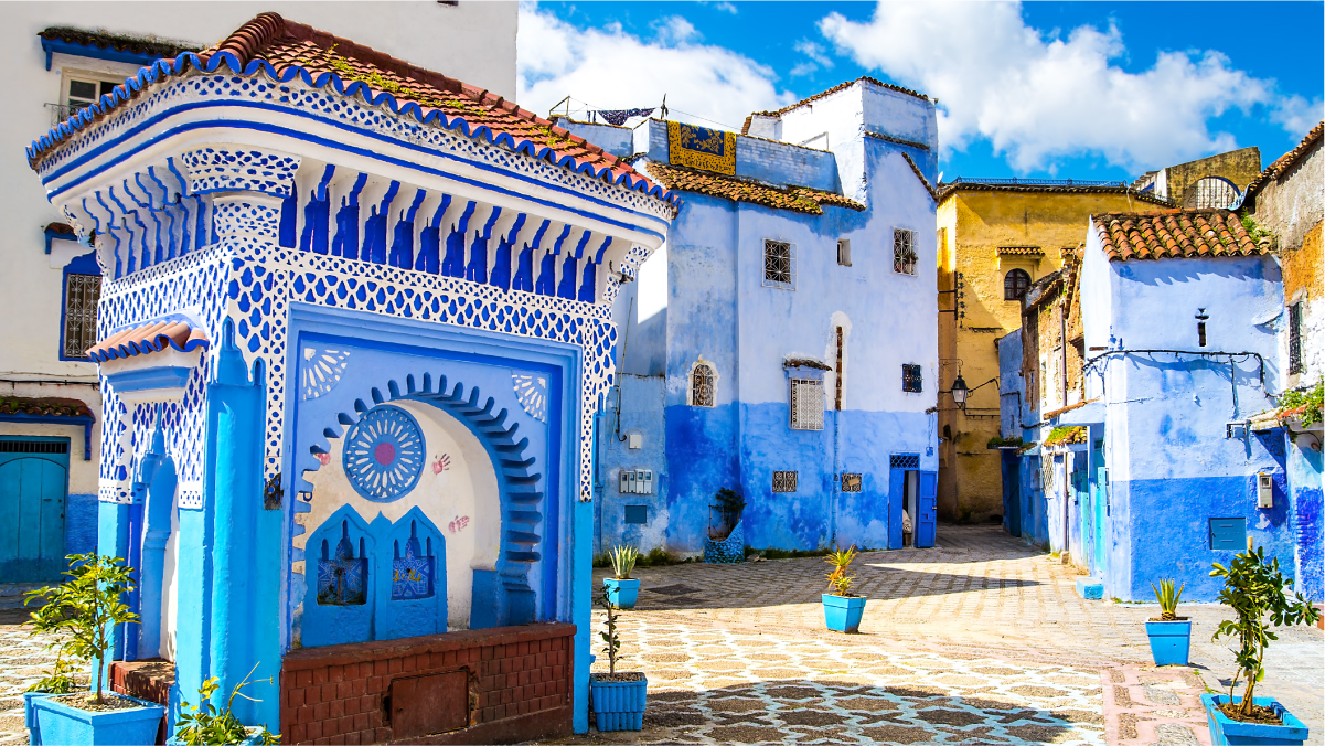 A plaza in the Moroccan city of Chefchaouen, where the exterior of buildings are painted blue. 