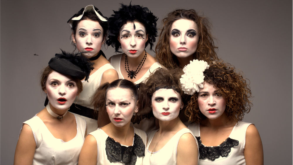 A studio portrait of the Dakh Daughters in their theatrical white face paint and costumes.
