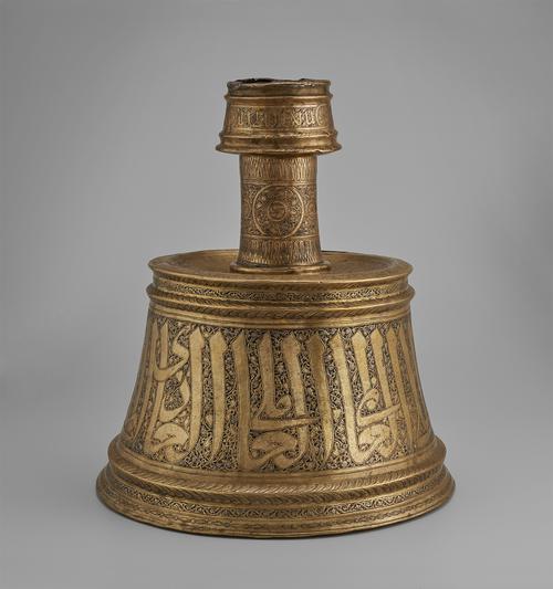 Candlestick with a conical base was hammered from brass sheet in two parts and soldered together.