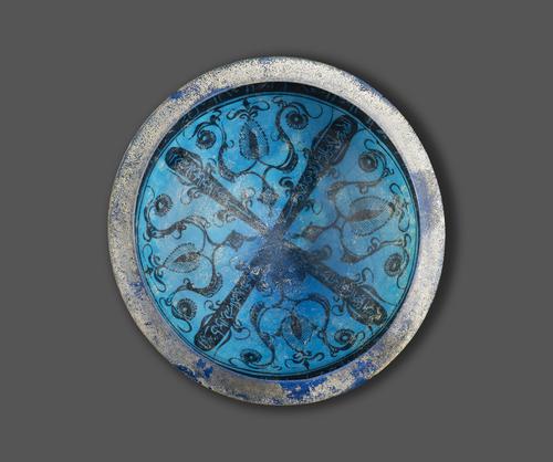 Bowl, turquoise glaze, the interior is divided into four sections by two intersecting bands of calligraphy. It has a round form with a T-section rim and a cobalt plain band around the rim.