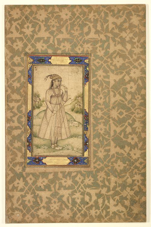 Drawing shows a young woman dressed in the Indian style, standing in the foreground and holding a flower to her nose while also holding a long, thin pipe in her right hand. Set inside an illuminated boarder on a green and brown patterned page.