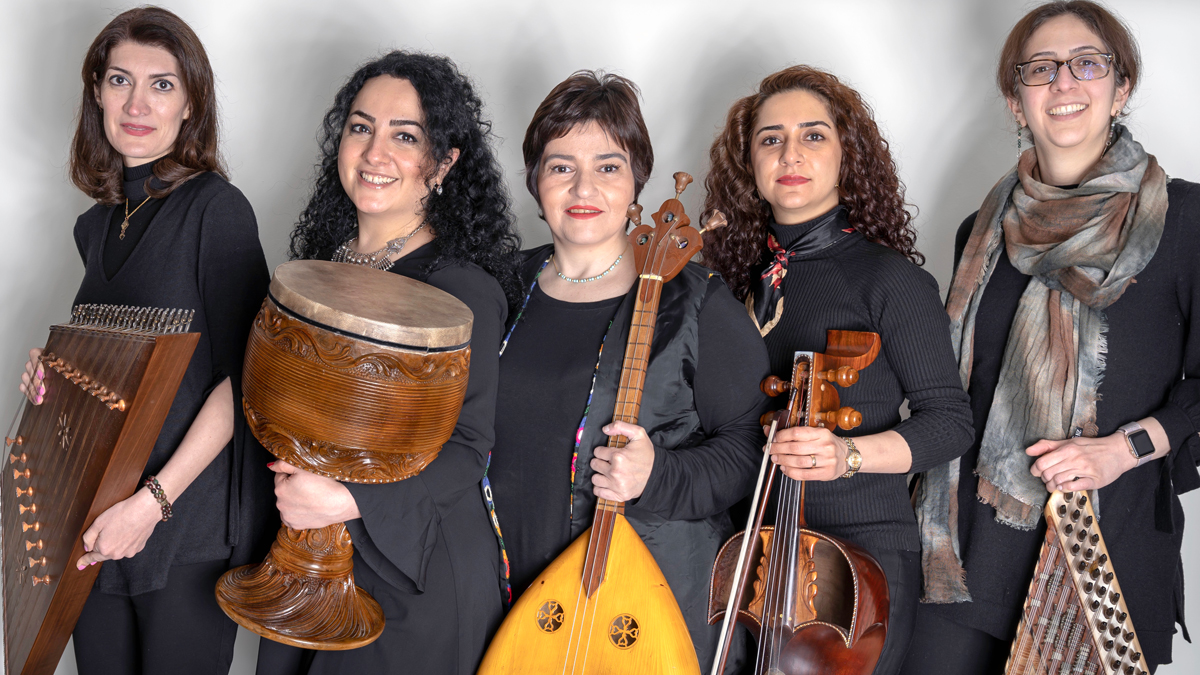 Five women stand with their instruments in this portrait.