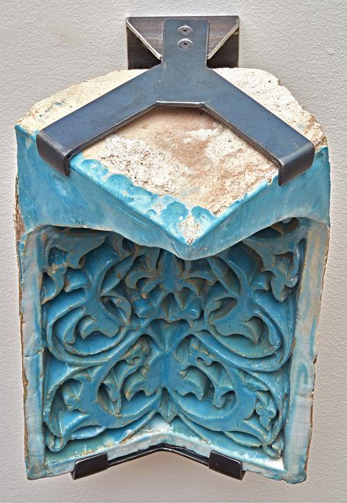 Blue turquoise rectangular ceramic tile, with floral carved design. Unglazed top, in mount.