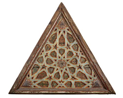 Second of three, wooden Equilateral triangular forms,  featuring beams forming radiating multi pointed stars, painted with a floral designs, the beams painted bright red, yellow and light blue, moulded unpainted frame.