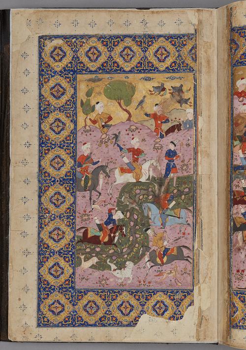 Gold and blue boarder of illuminated cartouche within a rectangular panel, with an inscription, and with floral patterns in pale pink, yellow, and white. Surrounding hunt-scene by a river.   