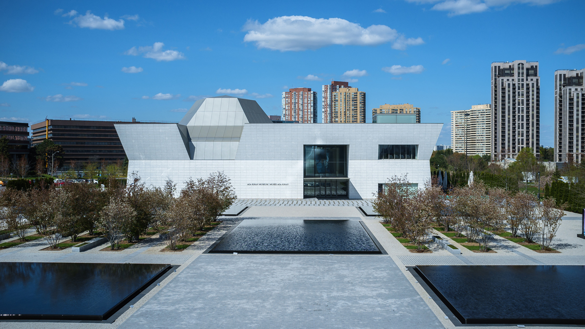 The Aga Khan Museum and Aga Khan Park seen from a distance on a sunny summer day.
