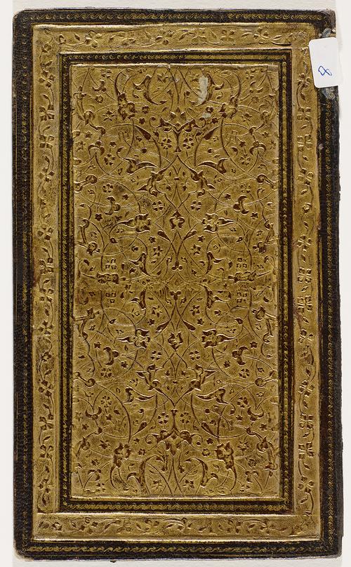 One side of a book binding with intricate gold gilt-stamped floral motifs. Simple gold gilt-stamped border with a thin floral pattern.