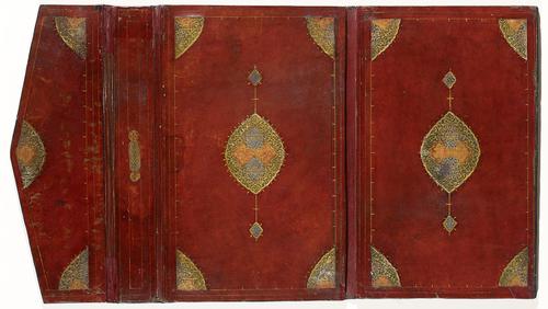 Red leather interior of bookbinding consisting of a front cover, spine, back cover, and two-part pointed flap. All tooled with a simple golden border, with decorations in each corner and a matching pointed oval design in the centre of each cover.